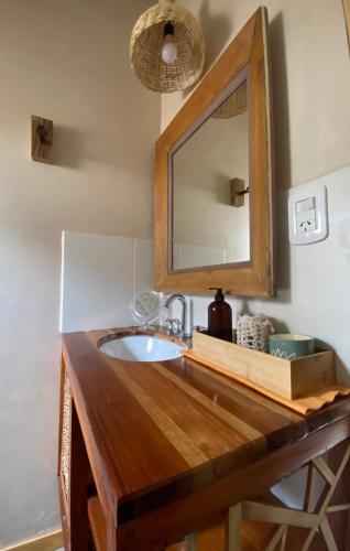 a bathroom with a sink and a mirror at Tinku Huasi Domos Suite in Tilcara