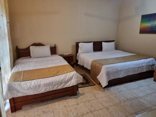 Una cama o camas en una habitación de Victory colombo
