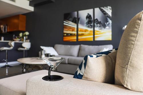 a living room with a couch and a table at Luxury Midtown Miami Apartment in Miami