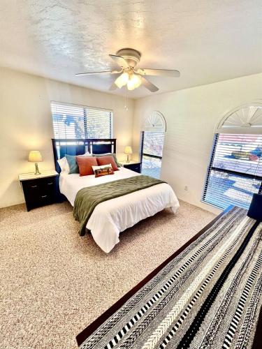 a bedroom with a bed and a ceiling fan at Grand Residence - Spacious Luxury 3 bed, 2 bath in Prescott