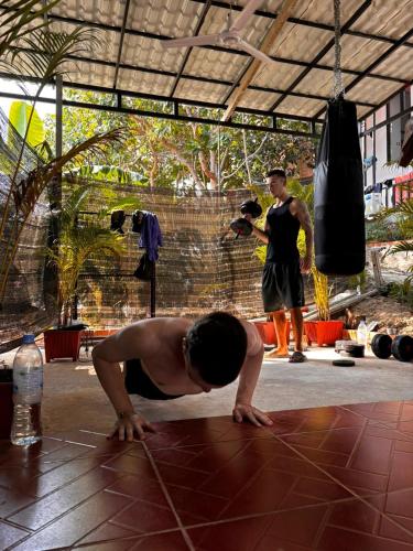 a man doing a push up in a yoga pose at Top View Kohrong in Koh Rong