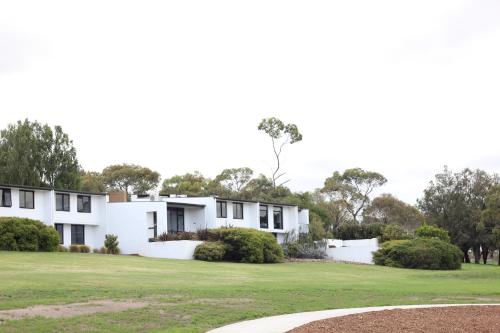 an image of a white house with a green yard at Waurn Ponds Estate in Waurn Ponds
