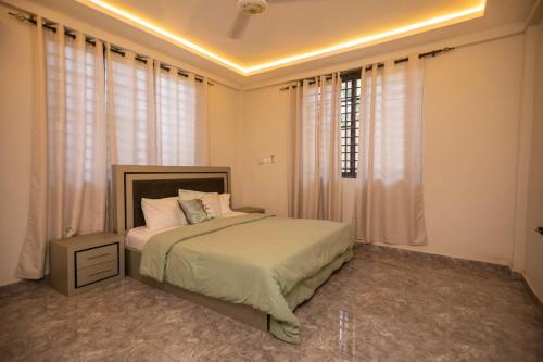 Ένα ή περισσότερα κρεβάτια σε δωμάτιο στο Agape Villa