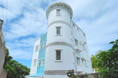 a lighthouse on the side of a building at Here Innstead Boracay in Boracay