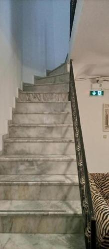 a set of stairs in a building with a stair case at Caglayan otel pansiyon in Bodrum City