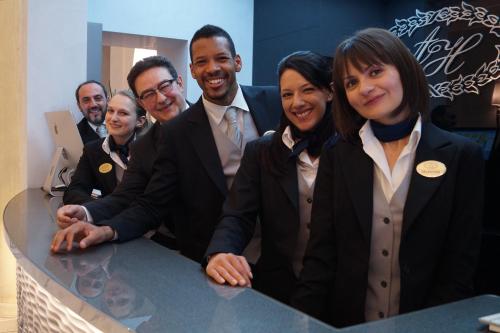 a group of people posing for a picture at Hotel Artemide in Rome