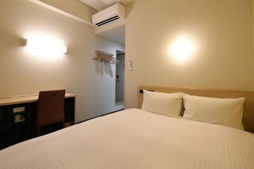 Postel nebo postele na pokoji v ubytování AB Hotel Seki