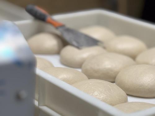 a container of buns with a knife in it at Hotel Astoria in Fidenza