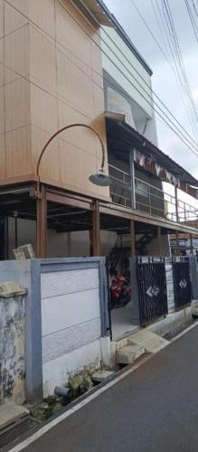 a building with a sign on the side of a street at Hotel Budget Urban Space - BUS in Semarang