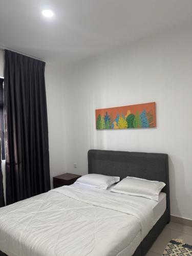 a bed with two pillows in a bedroom at Maryam Homestay Desaru with netflix disney plus in Bandar Penawar