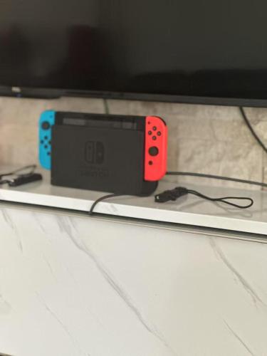 a nintendo wii controller sitting on top of a table at Brea Mall romantic two-bedroom house in Fullerton