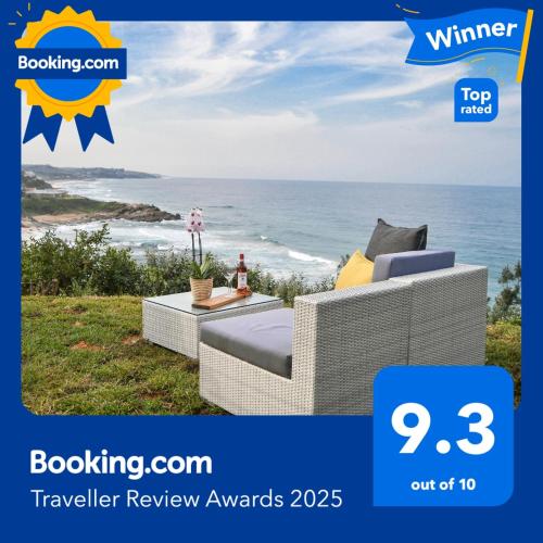 a magazine advertisement for a wicker chair with a view of the ocean at Palm Cove - 10 Thira, Santorini, best view over Thompsons Beach in Ballito