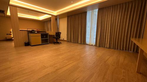 an empty room with a desk and a chair at 37th Crescent Navi Mumbai in Mumbai