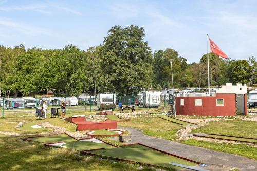 a group of people standing around a park with tents at First Camp Nickstabadet-Nynäshamn in Nynäshamn
