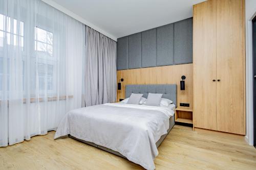 Posteľ alebo postele v izbe v ubytovaní Glow Apartments - Apartamenty Studio KOZIA Gdańsk Śródmieście