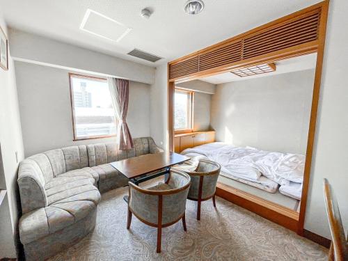 Ένα ή περισσότερα κρεβάτια σε δωμάτιο στο Hachinohe Plaza Hotel