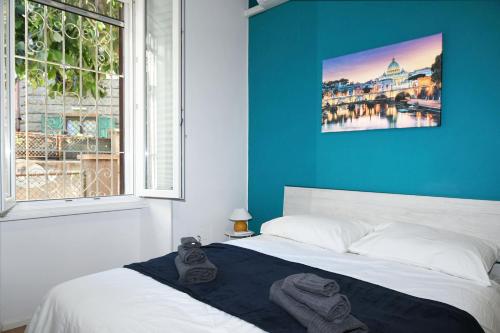 Postel nebo postele na pokoji v ubytování Casetta Garbatella