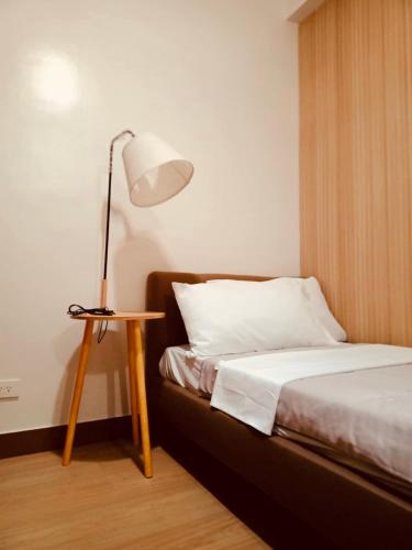 Postel nebo postele na pokoji v ubytování Kaunis Hive Hope Residences