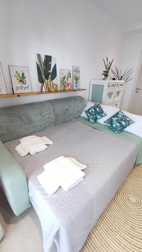 a large bed with two pillows on top of it at Villa Filothea with Jacuzzi and sea view in Spartýlas