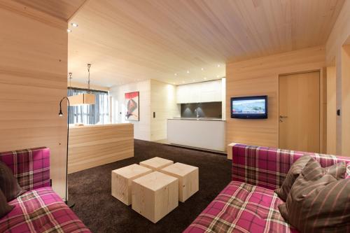 a living room with two couches and a table at Appartement Elmar in Obergurgl