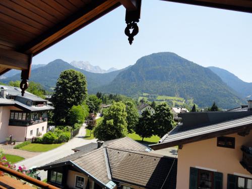 a view of the mountains from a house at Appartements Schmidsendl in Lofer