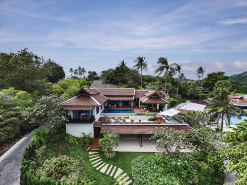 an aerial view of a house with a swimming pool at Anantara Lawana Koh Samui Resort in Chaweng