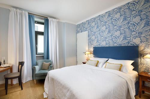 Postel nebo postele na pokoji v ubytování Hotel Goliath am Dom