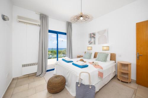 Postel nebo postele na pokoji v ubytování Villa Poseidonas
