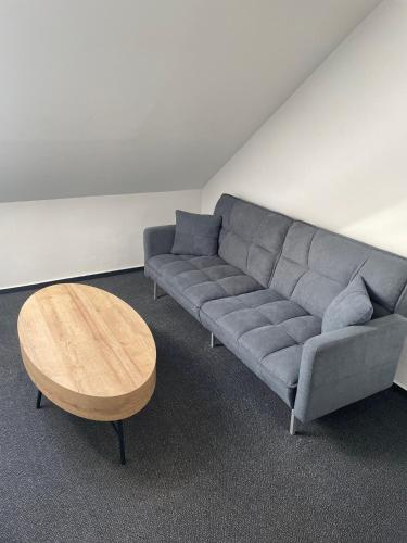 a living room with a couch and a coffee table at Hotel Maroli Mikulov in Mikulov