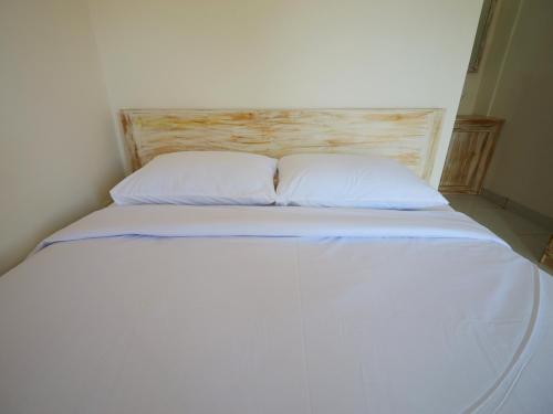 Ένα ή περισσότερα κρεβάτια σε δωμάτιο στο Ken Ken Guest House