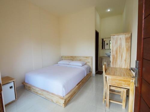 Ένα ή περισσότερα κρεβάτια σε δωμάτιο στο Ken Ken Guest House