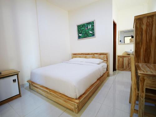 Ένα ή περισσότερα κρεβάτια σε δωμάτιο στο Ken Ken Guest House
