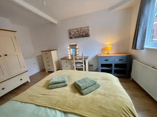 Ένα ή περισσότερα κρεβάτια σε δωμάτιο στο Top Floor Apartment