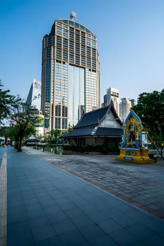 a building in a city with tall buildings at Elite Hotel Asok Sukhumvit 20 in Bangkok