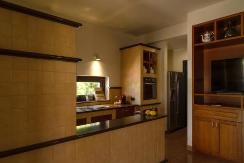 a kitchen with a sink and a counter top at Sammit holiday home in Michelica