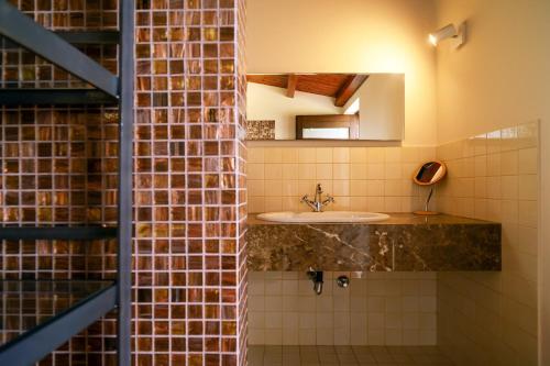 a bathroom with a sink and a mirror at Sammit holiday home in Michelica