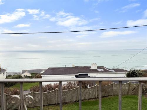 a view of the ocean from the balcony of a house at Seaside Escape-Sleeps10-Family&PetFriendly-Balcony in Porthleven