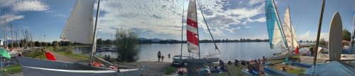 a group of sail boats on a lake with people at Ferien im Paradies - Wohnung Vera in Höchst
