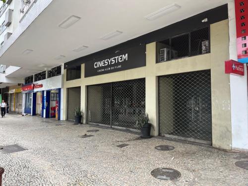 a building with a gate in the middle of a street at Praia de Botafogo vista Pão de Açúcar in Rio de Janeiro