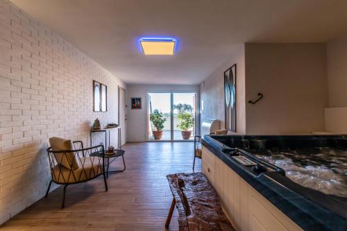 a large bathroom with a tub in the middle at Villa Porri by MMega in Siena
