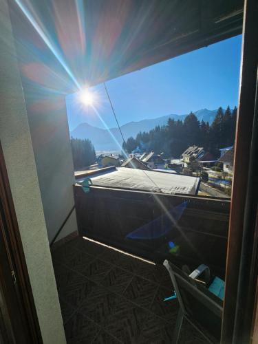 a window in a room with a view of a city at Karawanken Lodge in Faak am See