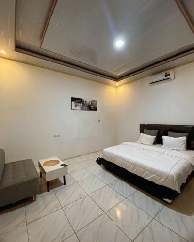 Ένα ή περισσότερα κρεβάτια σε δωμάτιο στο Bale Langgak Lodge