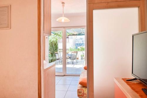 a room with a door leading to a patio at Apartment Ennio in Povlja