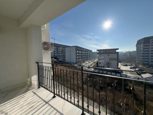 a balcony with a view of a city at COLLINE Rezidențial in Rediu