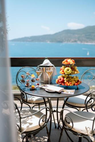 a table with a plate of food on it at Grand Hotel Bristol Spa Resort, by R Collection Hotels in Rapallo