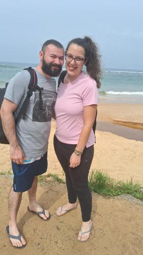 a man and a woman standing on the beach at RKO Villa27 - Unawatuna in Habaraduwa
