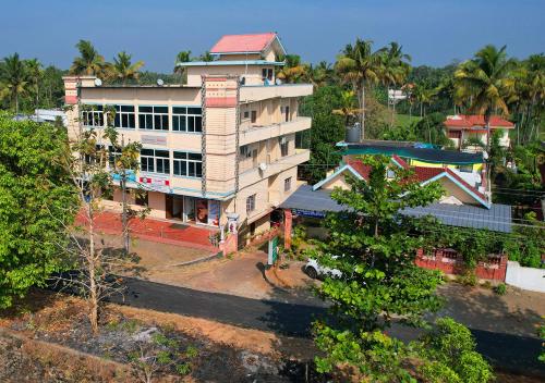 an overhead view of a building in a city at Namasthe Ayurveda and Yoga Retreat Cochin in Nedumbassery