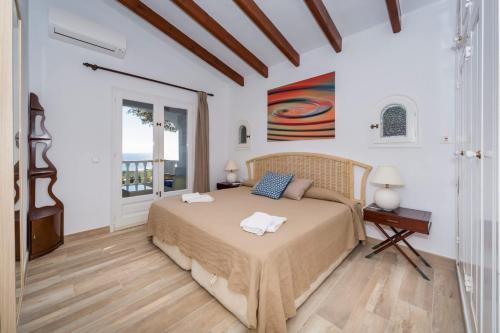 a bedroom with a bed with two towels on it at San Jaime View - stunning sea views close to resort in Son Bou