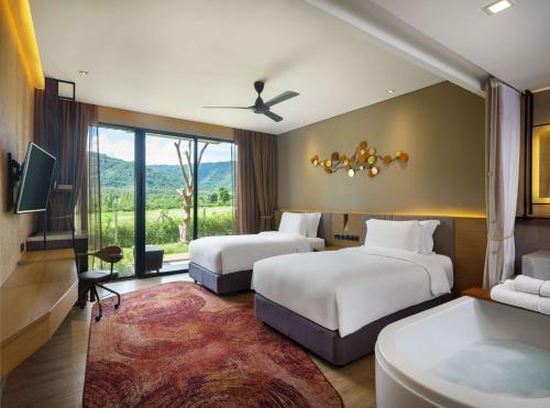 Ein Bett oder Betten in einem Zimmer der Unterkunft dusitD2 Khao Yai