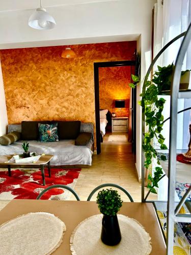 a living room with a couch and a table at Iulius Mall Area Apartament in Iaşi